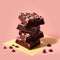 pieces of brownies stacked on a pink background.