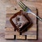 Pieces of chocolate brownie on a wooden with fork