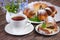 Pieces of chocolate marble cake and coffee on a wooden background