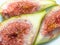 Pieces of chopped green figs. Juicy ripe fruit. Diet food. Fig isolate. Seeds inside