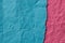 Pieces of creased blue and pink paper background texture