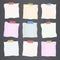 Pieces of crumpled cut colorful lined note paper are stuck on dark gray background