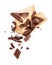 Pieces of crushed chocolate are fly out of a paper wrapper