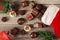 Pieces of delicious assorted chocolates are coming out of a christmas stocking on wooden table