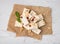 Pieces of delicious nutty nougat on white textured table, top view