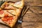 Pieces of different pizza various types. Wooden background. Top view. Copy space