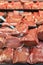 Pieces of fresh chilled beef on the counter under the glass, Selection of quality meat at a butcher shop, vertical photo