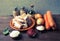 Pieces of fresh fish on a plate, vegetables, flour, tomatoe past