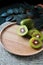 Pieces of Fresh Red Kiwifruit on Wooden Plate