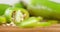 Pieces of green pepper with seeds slowly rotate.