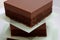 Pieces of homemade healthy cakes of cocoa with a rich, creamy glaze of milk chocolate gluten free