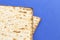 Pieces of Matzah Bread Unleavened Bread on a Blue Background