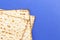 Pieces of Matzah Bread Unleavened Bread on a Blue Background