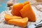 Pieces of native French aged cheese Mimolette, produced in Lille