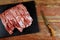 Pieces of pork meat on chopping board