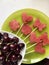 Pieces of the pulp of watermelon are cut with a stamp. They are given different forms. Stringed on skewers for a picnic. There are