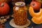 Pieces pumpkin canned for the winter in a jar located on a dark background
