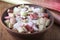 Pieces of rhubarb with sugar in a clay bowl