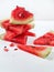 Pieces of ripe juicy fresh watermelon stacked on top of each other on a white background