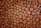 Pieces of round wood circles in a pattern. Natural organic neutral background texture flat surface. Small circular shapes in a sq