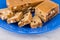 Pieces of sherbet with peanut and raisins in blue plate