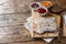 Pieces of smoked boiled pork on a wooden rustic Board with bread, sauces and spices on a wooden table. Copy space