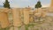 Pieces of sophisticated marble columns piled on ground, ancient building ruins