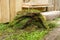 Pieces of turf on the background of wooden structures