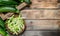 Pieces of zucchini in a bowl and whole zucchini tray