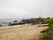 Piedras Negras beach with a boat on the sand in Pontevedra