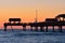 Pier 60 on colorful sunset background. It is one of the best-equipped and most attractive fi