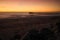 Pier on the Atlantic Ocean in Swakompund, Namibia. Beautiful sunset with a bright sky and soft gentle water