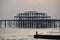 Pier and beach in Brighton, the United Kingdom. Photo made at dusk. Birds, couple, pier