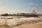 The pier at Blackpool with large ferris wheel and waves.