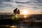 Pier with blurred couple at dusk