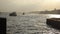 Pier and boats, the Bosphorus and the Golden Horn in the city of Istanbul. Golden evening or mor