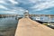 Pier with boats of Isola delle Femmine or the Island of Women located on the shore of Mediterranean sea in, Si