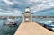 Pier with boats of Isola delle Femmine or the Island of Women located on the shore of Mediterranean sea in, Si