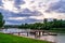 Pier with boats. landscape. summer green meadow by river in Sunny weather