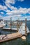 Pier of Boston Wharf and sailboats in Charles River