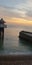 Pier Brighton pebbles sunset calm