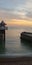 Pier Brighton pebbles sunset calm