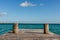 Pier with clouds and blue water at the Laguna Bacalar, Chetumal, Quintana Roo, Mexico.