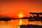 pier and fishing boats with a beautiful sunrise in the background, on the serangan island of Bali's