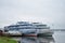 Pier on the foggy river cruise ships retro ships in the water surface reflected thick