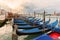 Pier gondolas near Piazza San Marco in Venice at sunrise.