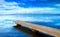 Pier or jetty, sunset blue panoramic landscape. Orbetello lagoon