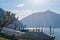 Pier of the Lake Ceresio of village Bissone near Lugano on a sunny day. Canton Ticino. Switzerland