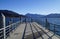 a pier on lake Tegernsee in Bavaria with the wintery Alps in the background on a sunny December day (Bavaria in Germany)