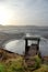 A pier leading to empty pond in autumn